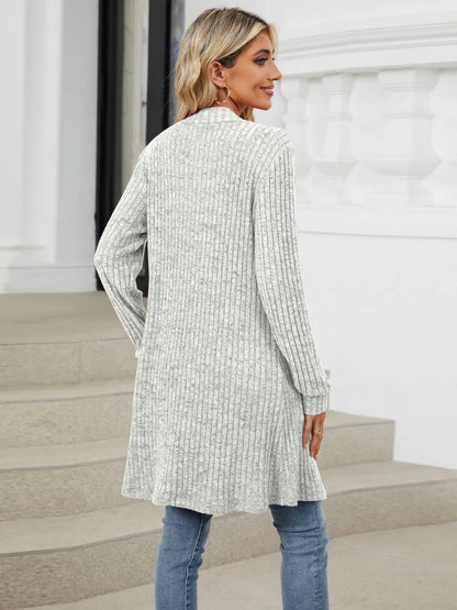 Autumn and winter long color long sleeved loose pocket cardigan jacket for women