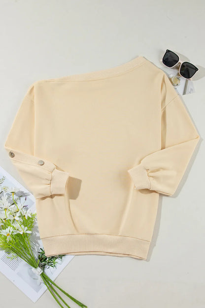 Light yellow asymmetrical collar button up sleeves off shoulder sweatshirt